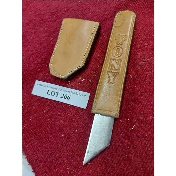 Knife with engraved leather handle and case