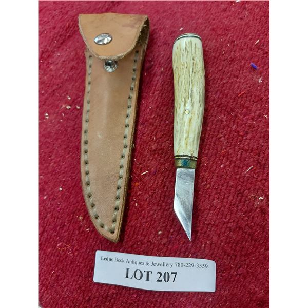 Knife with antler handle and leather case