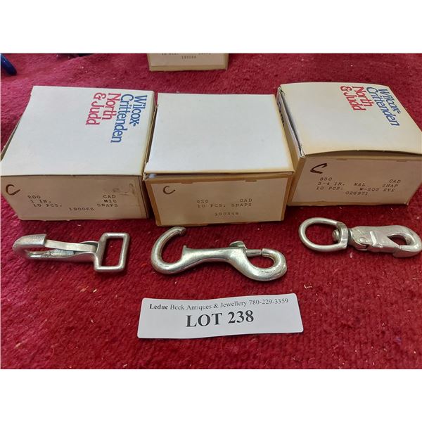 18 polished nickel rosettes, 10 galvanized snaps, 10 swivel snaps