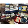 Image 2 : Asst 8-track and cassette tapes, Polaroid flash gun #268, Suntone portable radio, Korg Drg. Tuner Me