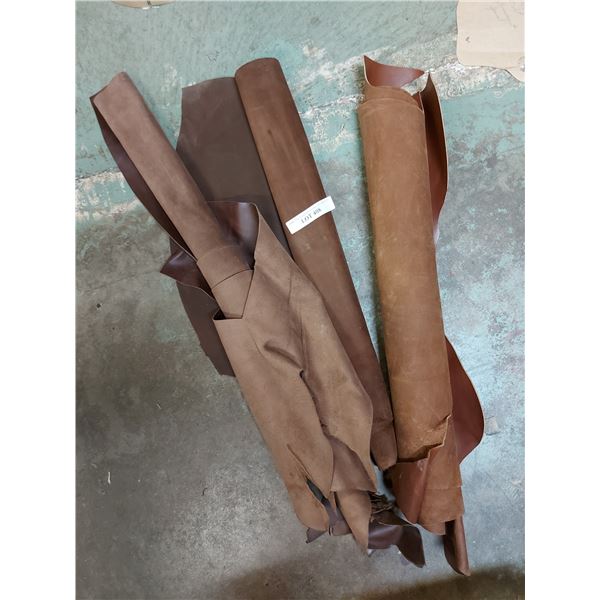 Asst rolls of brown shaded designer whole hides