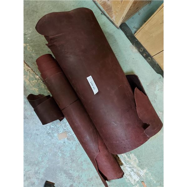 Asst rolls of red latigo side cowhide