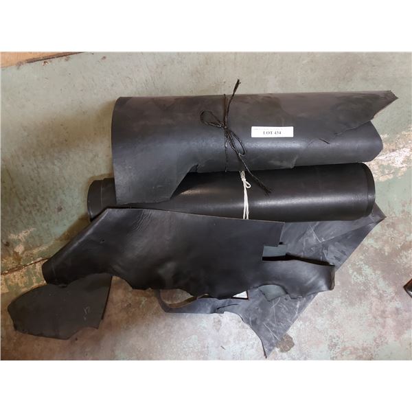 Asst rolls of black latigo side cowhide