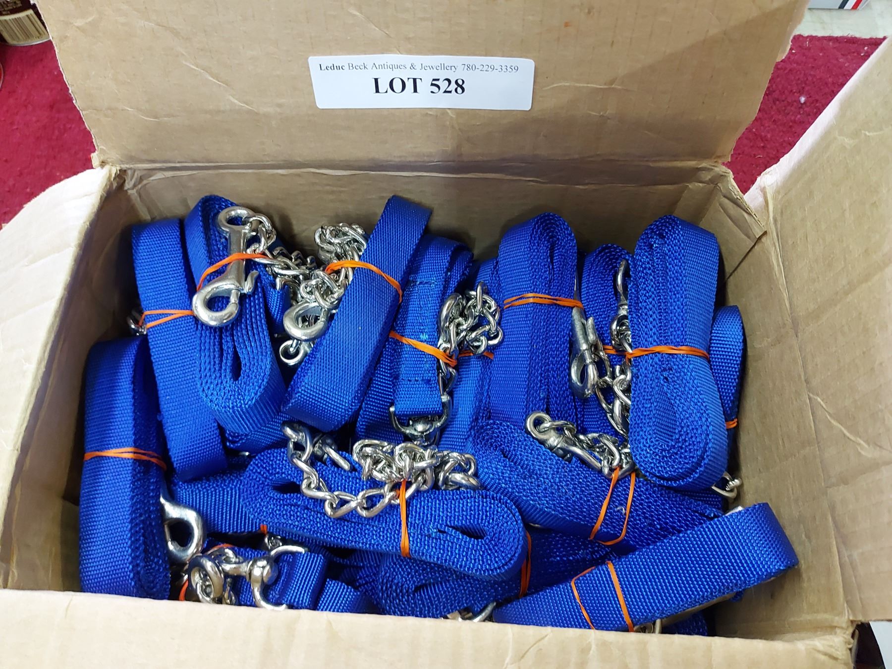 1 box Blue webbing with snaps and chain - Beck Auctions Inc.