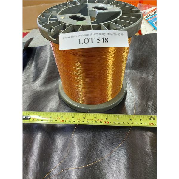 Spool of copper-coloured wire