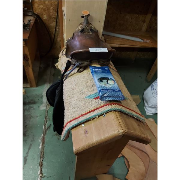 Saddle horse, horse blanket, decorative saddle (needs TLC), rope bag, hoof grooming towels