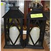 Image 1 : 2 FLICKERING CANDLES IN 10 IN GLASS SIDED LANTERN+