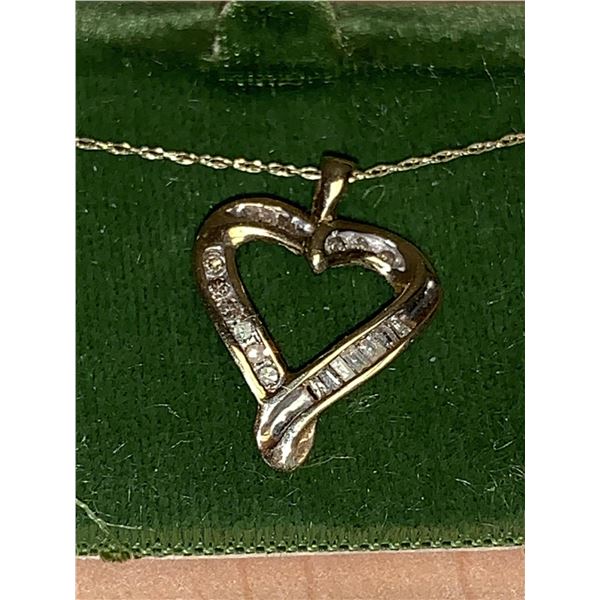 Heart Shaped Diamond .40 carat round/baquette cut Pendant and chain set with appraisal $1,900.00