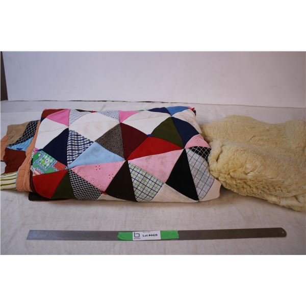 Handmade Quilt and sheepskin? rug