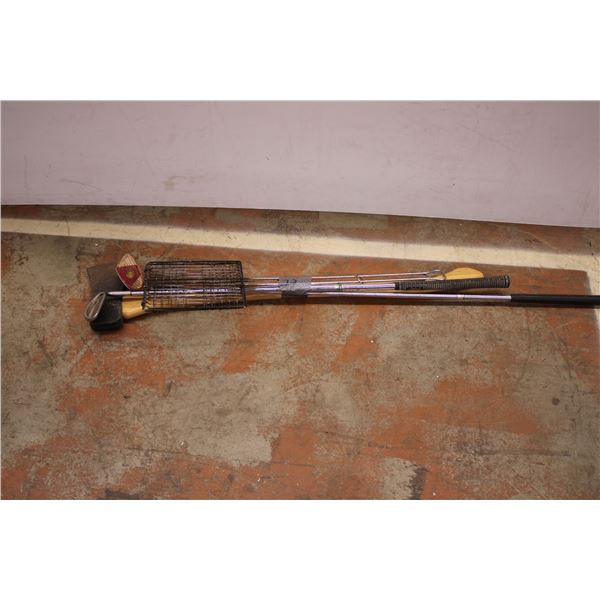 large axe, golf clubs, camping fire cooking cage