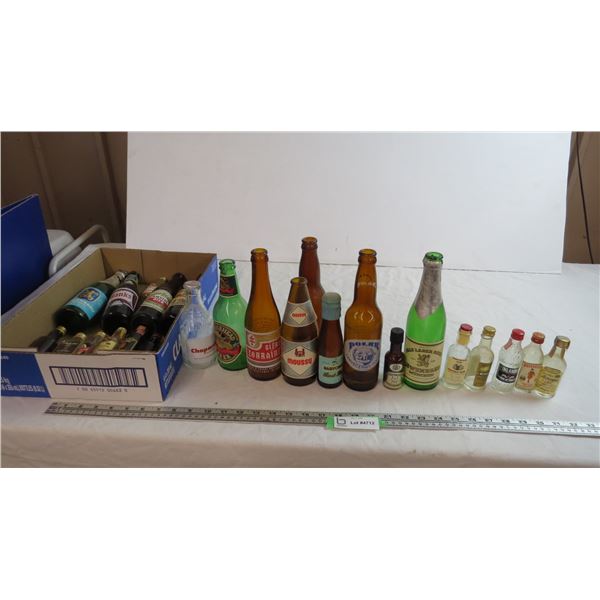 lot of alcohol bottles - polar bear beer, moosehead, misc