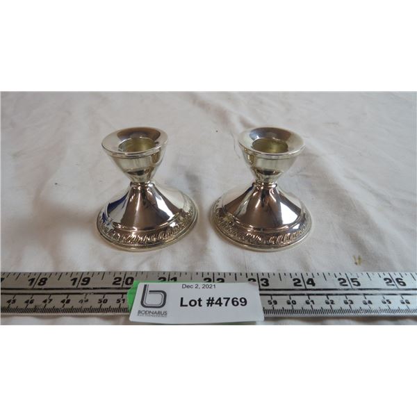 pair of sterling weighted candle holders