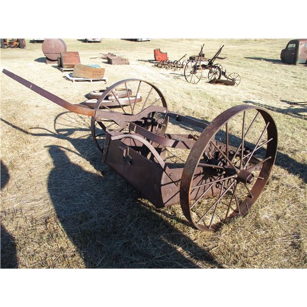 REMOTE PICKUP IN TUGASKE, SK - Cast iron pull scoop with 38" diameter wheels