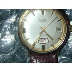 Man's 14 kt Gold Auto Gruen Day Date #2390367