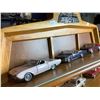 Image 2 : FRANKLIN MINT COLLECTION OF 12 CARS "THE CLASSIC CARS OF THE SIXTIES" INCLUDES WALL MOUNT SHELF AND