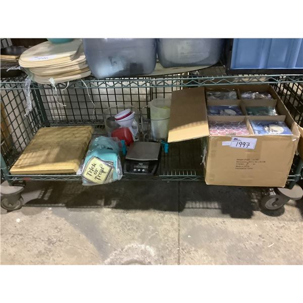 SHELF LOT OF ASSORTED NAPKINS, SCALE, CUTTING BOARDS, AND MORE