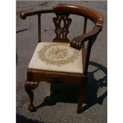 Carved roundabout chair with needlepoint seat