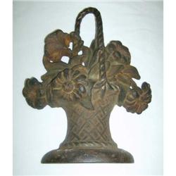 Two cast iron doorstops inc Basket of Flowers