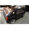 Image 8 : 12 VOLT RIDE ON DOUBLE SEATER CADILLAC ELECTRIC CAR WITH RADIO AND CHARGER WORKING