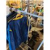 Image 1 : 3 rolling clothing racks (x3) & assorted jackets, wall rack, short ankle rubber boots, sorrel steel 