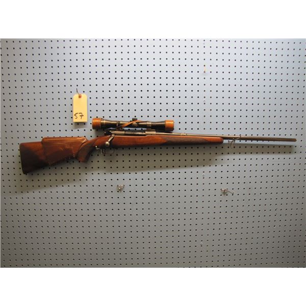 Winchester Model 70 (pre-1964); bolt action .257 Roberts cal; 24" barrel w/Lyman Challenger (dot) sc