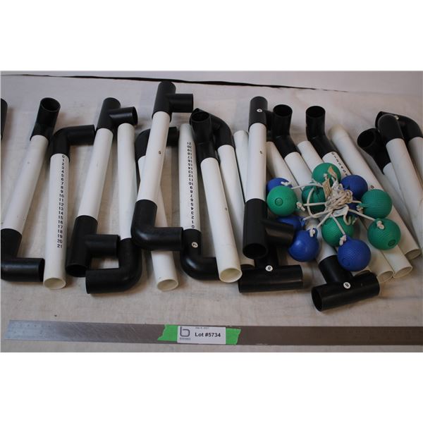 Ladder toss game with balls