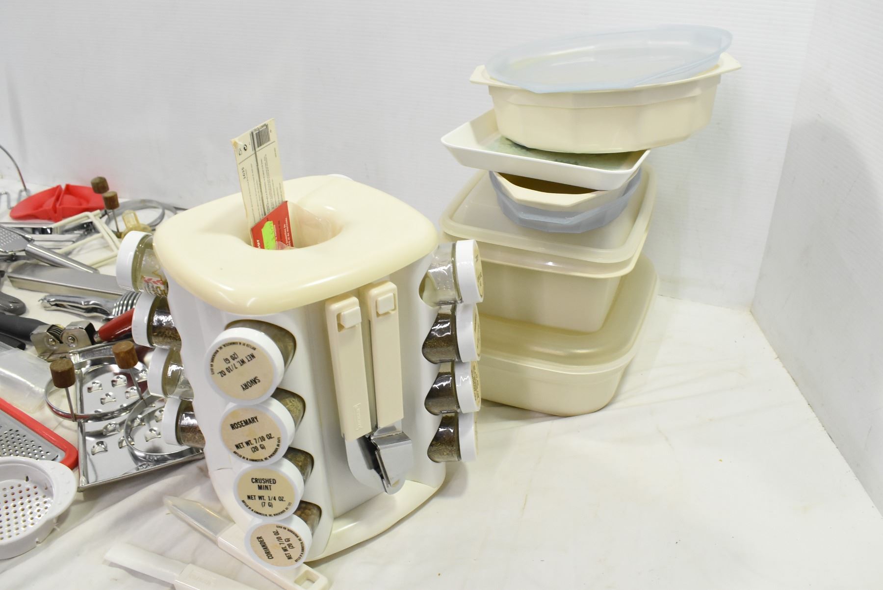 kitchen accessories, cheese graters, tupperware, spice rack