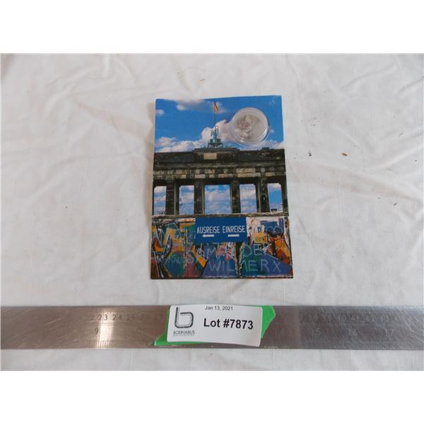 Rocks from the Berlin wall in a postcard