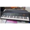 Image 6 : Yamaha portasound PCS-500 Keyboard + music books (working)