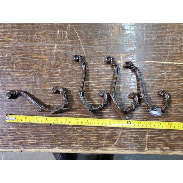 four 6" iron coat hooks