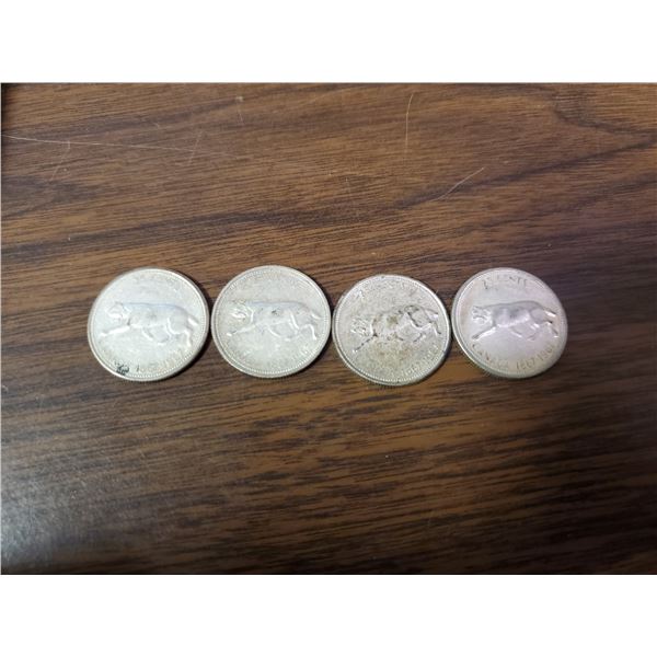 four 1967 silver Canadian quarters