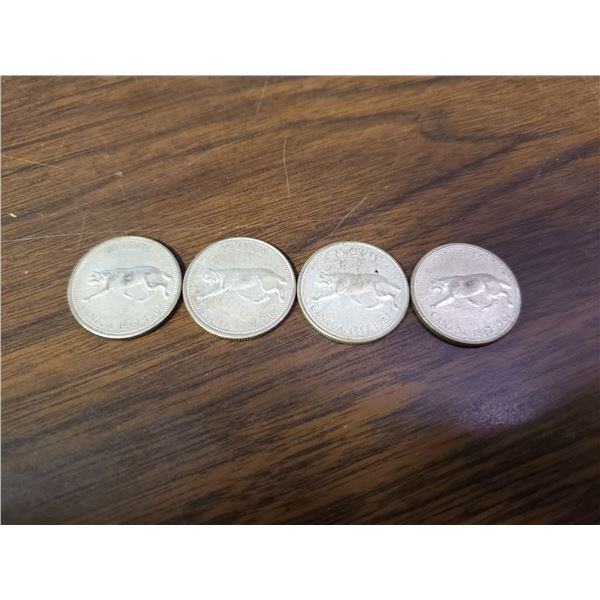 four 1967 silver Canadian quarters