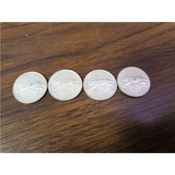 four 1967 silver Canadian quarters