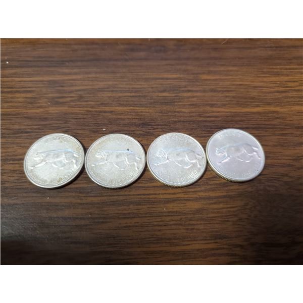 four 1967 silver Canadian quarters
