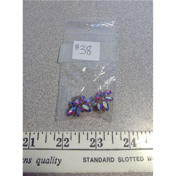 Pair of red rhinestone clip earrings marked Sherman