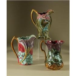 THREE FRIE ONNAING VICTORIAN MAJOLICA PITCHERS