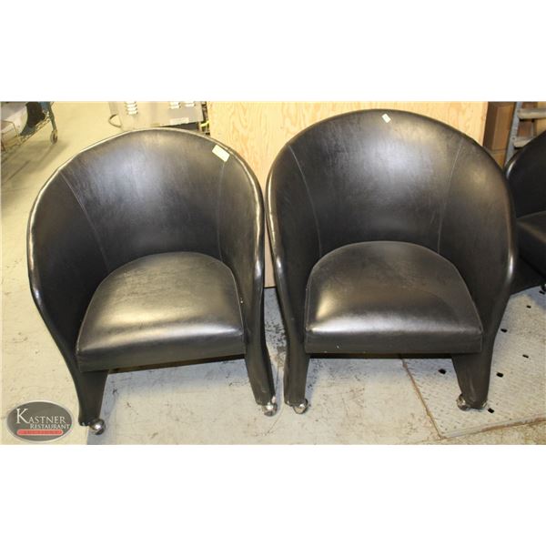 LOT OF TWO LEATHERETTE BUCKET CHAIRS ON CASTORS