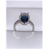Image 1 : Blue Topaz Oval Cut Solitaire Ring 1.1 Carat Wt set in .925 silver and cluster stones surround size 