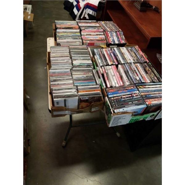 2 BOXES OF DVDS AND BOX OF CDS