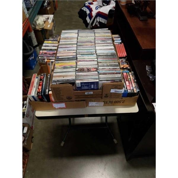 4 BOXES OF DVDS AND BOX OF CDS