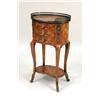 Image 1 : A LOUIS XV-STYLE MARQUETRY AND PARQUETRY INLAID ORMOLU-MOUNTED OVAL SIDE TABLE