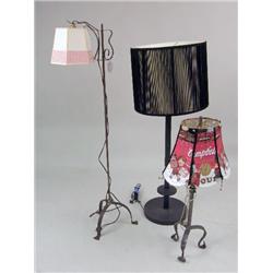 A PATINATED METAL FLOOR LAMP