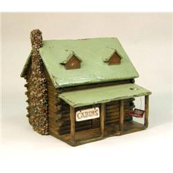 A PAINTED AND STAINED WOOD LOG CABIN BIRDHOUSE