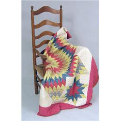 A PENNSYLVANIA DUTCH "LONE STAR" PATTERN PIERCED COTTON QUILT