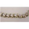 Image 2 : A 14K YELLOW GOLD AND DIAMOND "TENNIS" BRACELET
