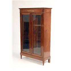 AN EMPIRE TWO-DOOR MAHOGANY BIBLIOTEQUE