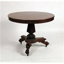 A PHILADELPHIA EMPIRE CARVED TILT TOP CENTER TABLE