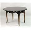Image 1 : A CARVED MAHOGANY GRANITE-TOP TABLE