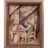 Image 2 : A FRAMED WOOD CARVING OF A MAN AT A DESK