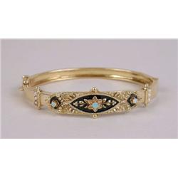 A 14K YELLOW GOLD OPAL, SEED PEARL AND ENAMEL HINGED BANGLE BRACELET